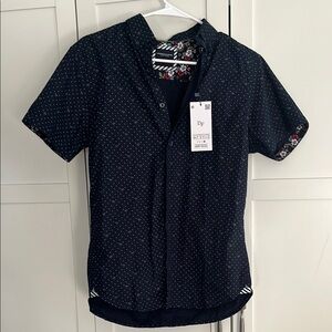 Young men’s navy polka dot and palm tree shirt
